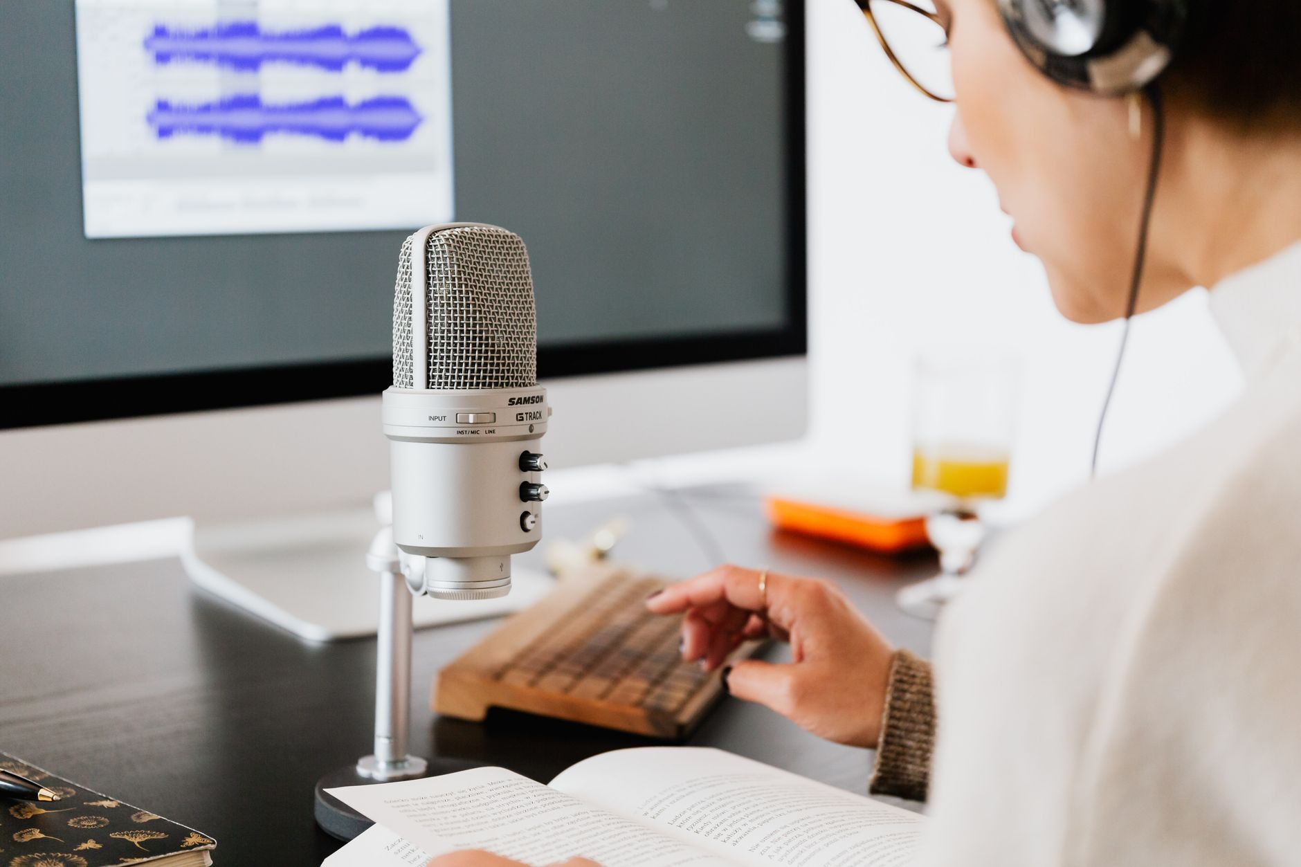 USB condenser microphone on desk podcast setup