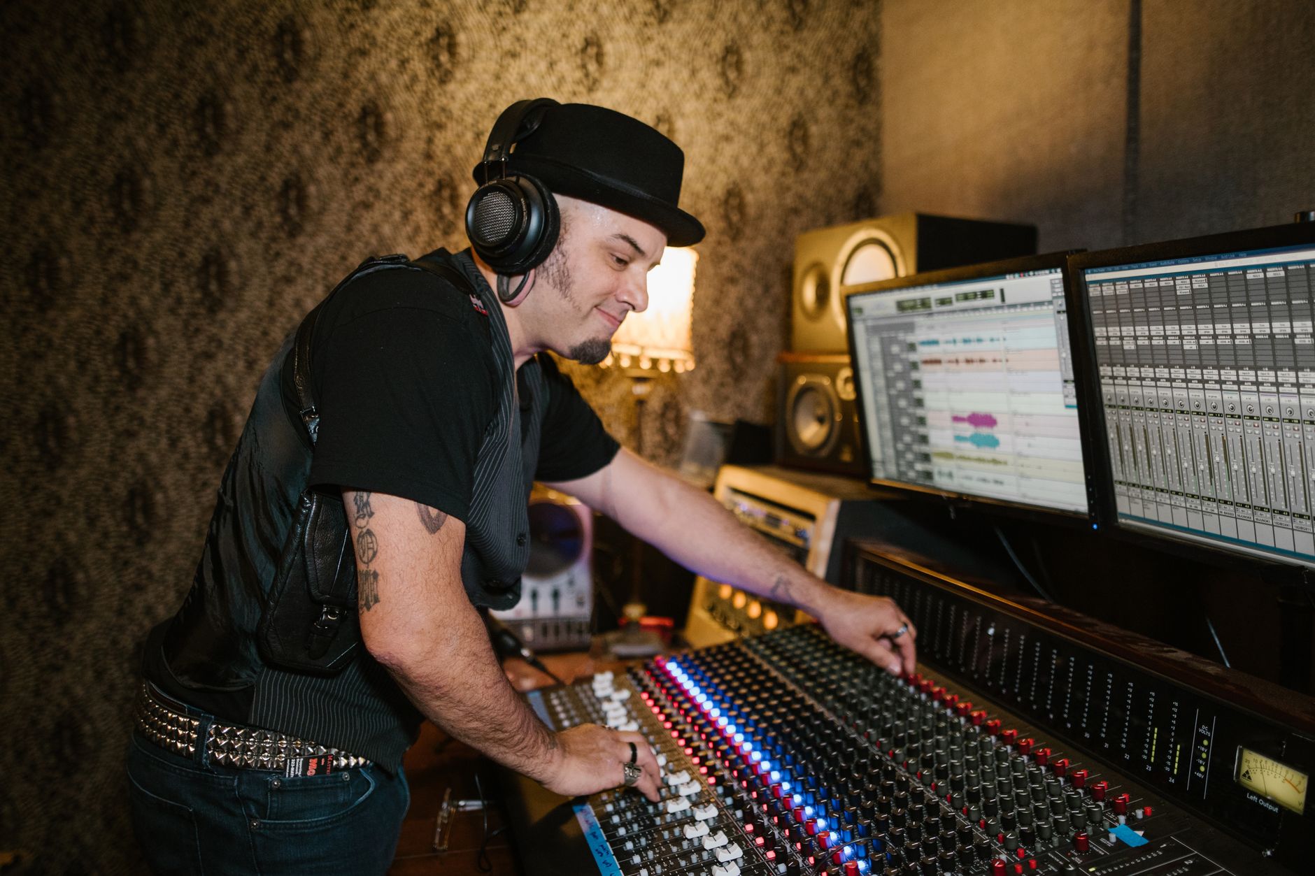 near-field studio monitors on desk with acoustic foam panels