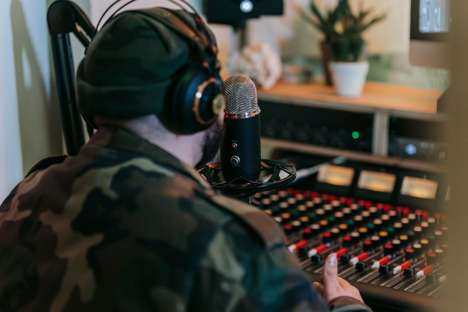 small format mixer on home studio desk with microphones