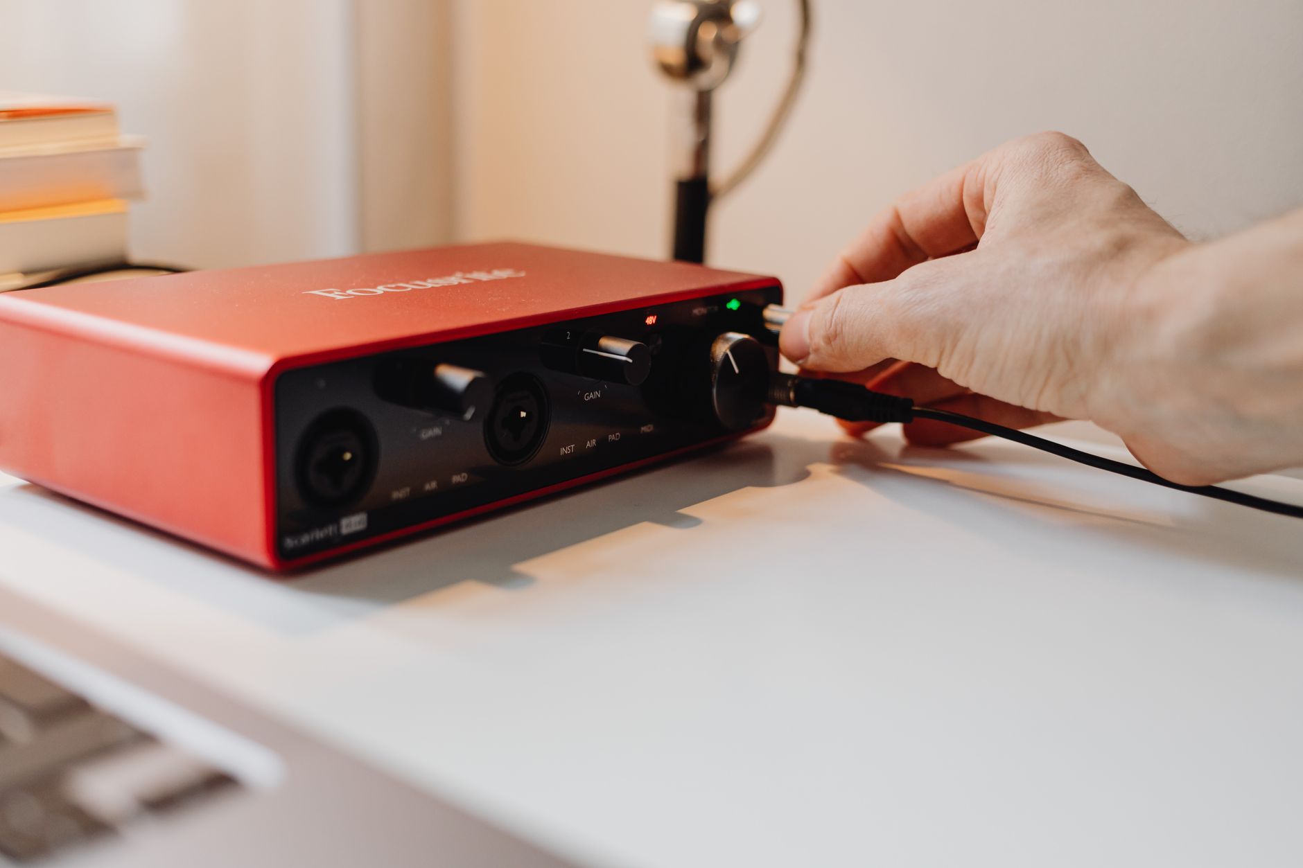 XLR cable plugged into Focusrite Scarlett Solo input panel