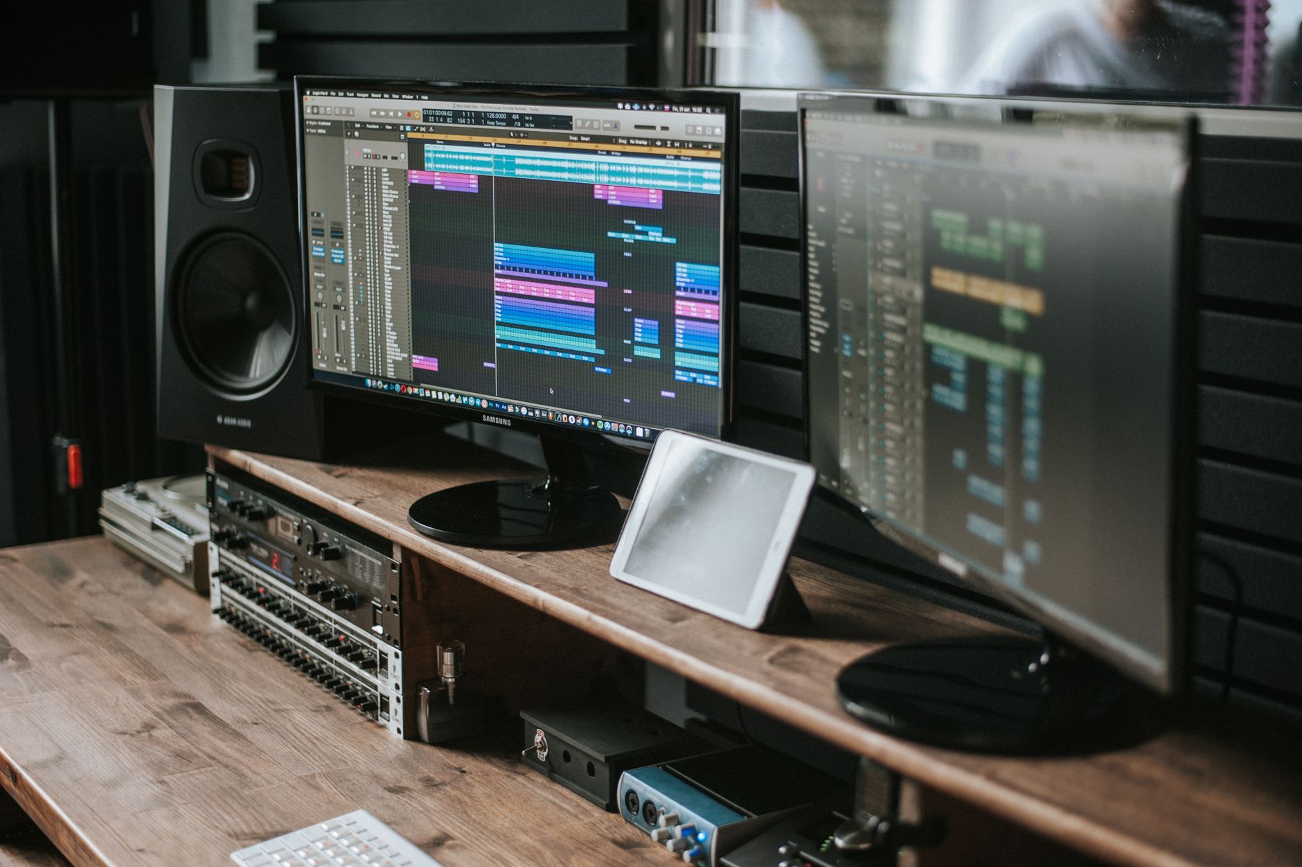 home studio desk with condenser mic and audio interface