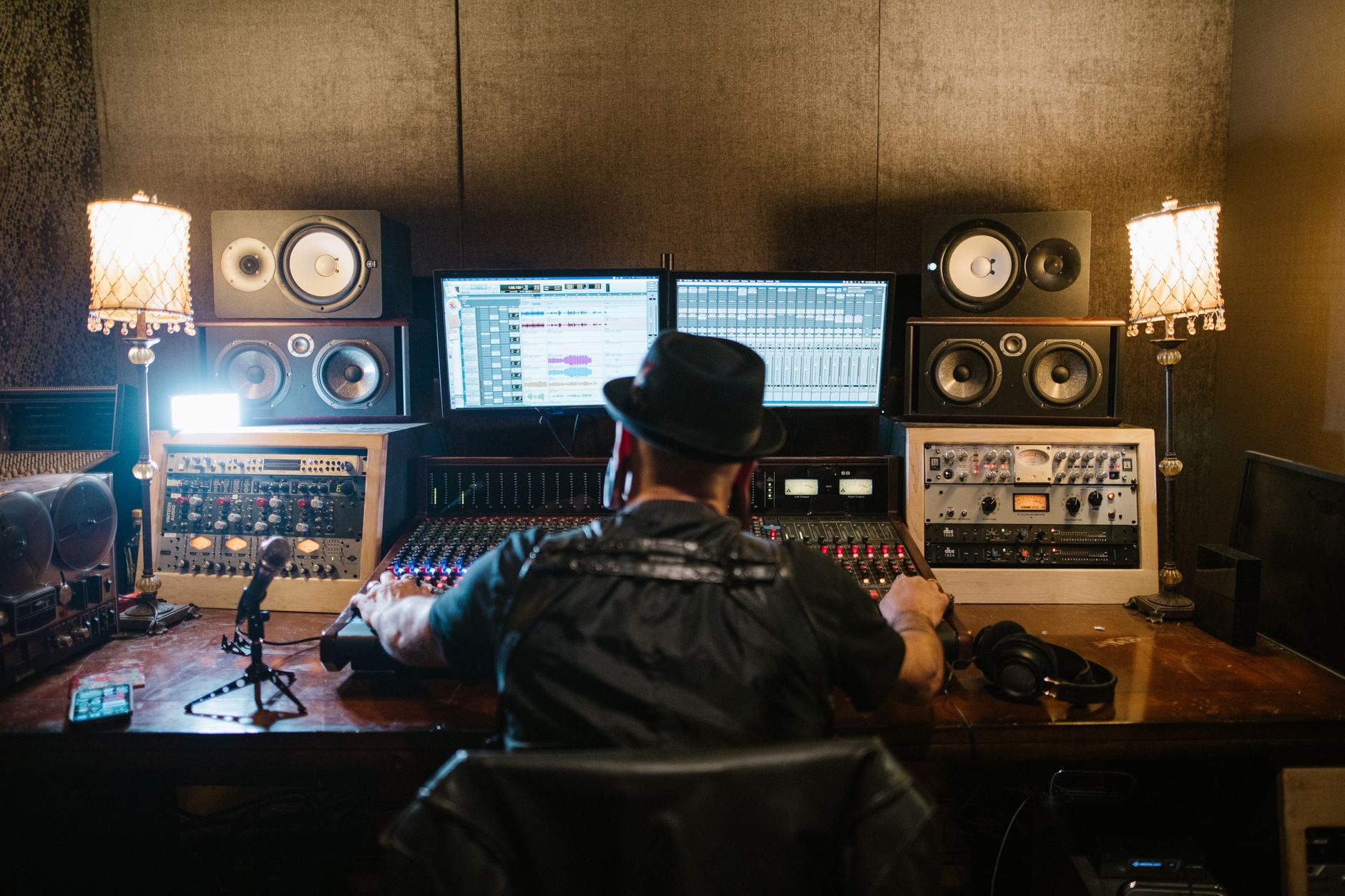 condenser microphone connected to audio interface on desk